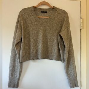 Cropped cream V-neck sweater